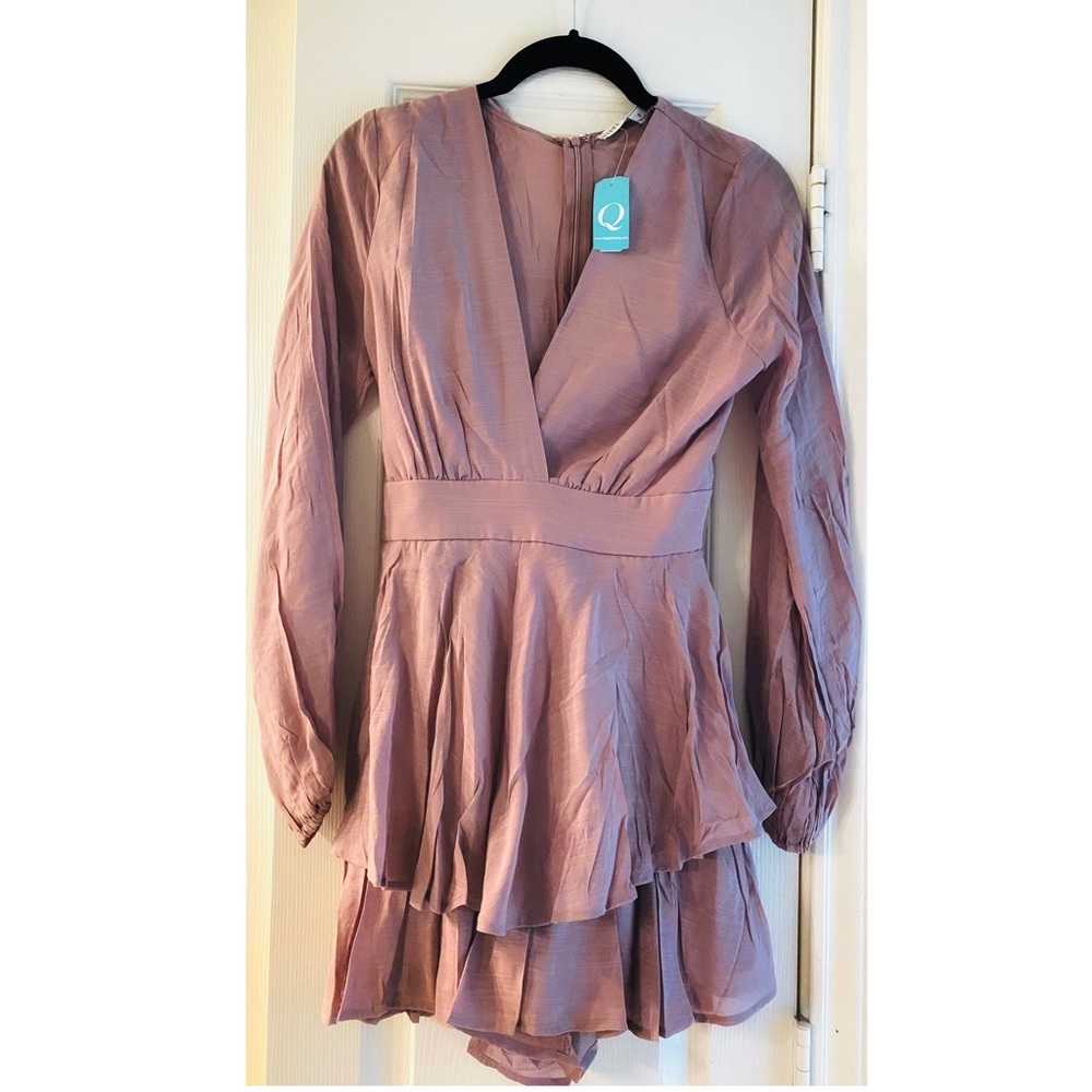 Romper long sleeve new with tags. Size Small